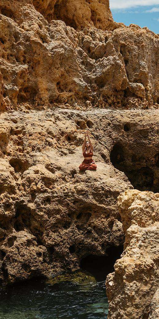 Yoga on the rocks above the Atlantic