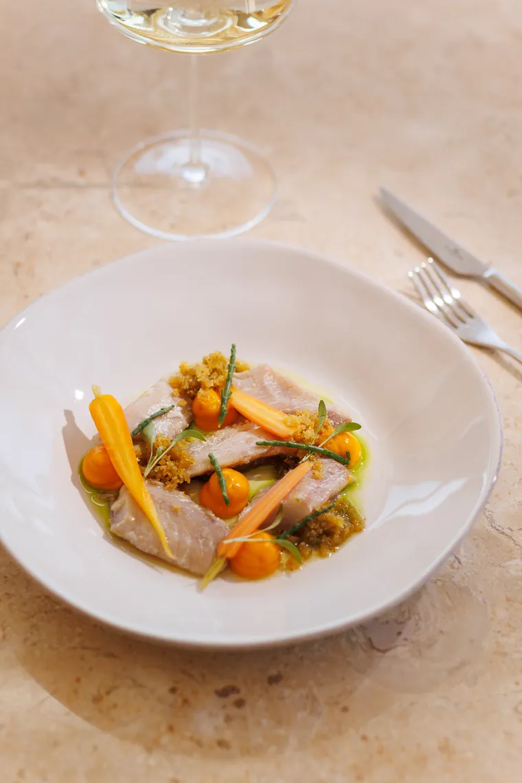 Poached fish with carrots and samphire