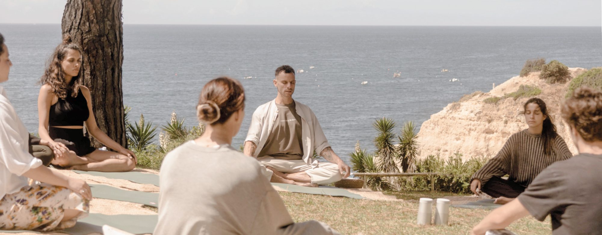 Outdoor meditation class above the sea